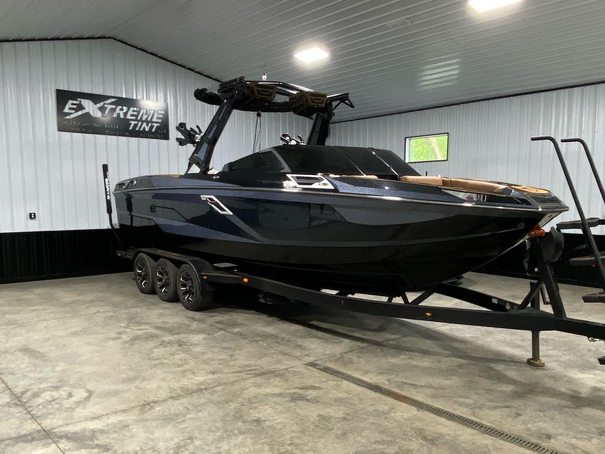 Black boat with window tint in Extreme Tint shop
