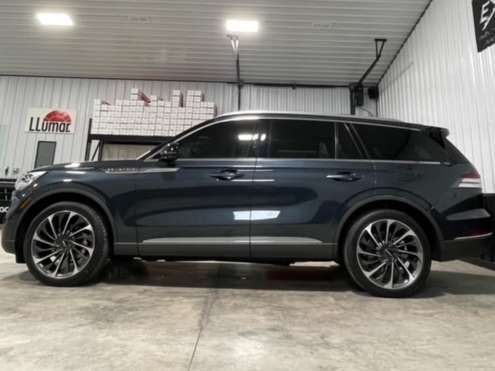 Car with ceramic window tint in shop